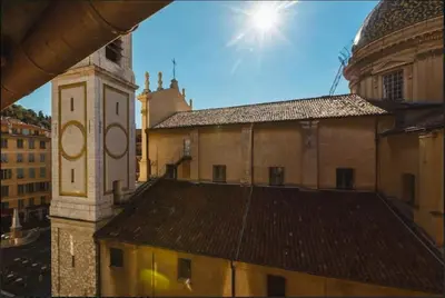a view of a building with a clock tower at Nice Renting - COLONNA - Best place in Nice Old Town in Nice
