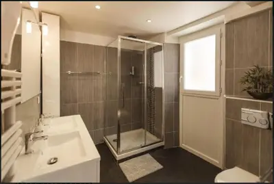 a bathroom with a shower and a sink and a tub at Nice Renting - COLONNA - Best place in Nice Old Town in Nice