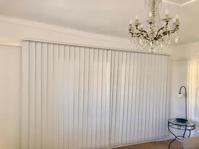 a large white blind in a room with a chandelier at Chez Kari-top location in charming old town in Nice