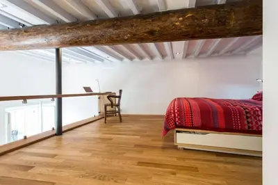 a bedroom with a bed and a desk at Le Noble in Scenic Villefranche Sur Mer in Villefranche-sur-Mer