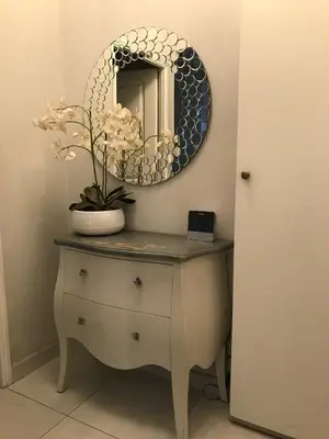 a mirror on top of a dresser in a room at Je suis à Nice in Nice