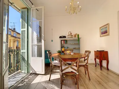 a dining room with a table and chairs and a window at Nestor&Jeeves - LAVINIA - Central - Close sea in Nice