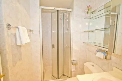 a bathroom with a shower with a toilet and a sink at PROMENADE HOLIDAY - ORIENT & SEA in Nice