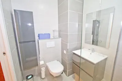a bathroom with a toilet and a sink and a shower at PROMENADE HOLIDAY - COSY SEA FRONT STUDIO in Nice