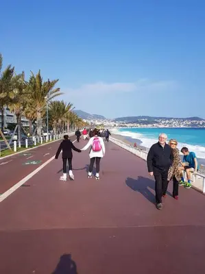 a group of people walking on the beach at Studette en plein cœur du Vieux Nice in Nice