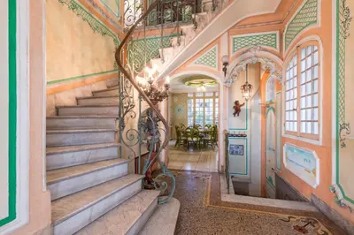 a staircase in a home with ornate walls and ceilings at Villa COLLIN - Promenade des Anglais in Nice