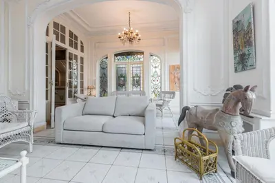 a living room with a couch and a statue of a horse at Villa COLLIN - Promenade des Anglais in Nice