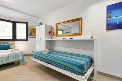 a bedroom with a bed and a mirror at Les Oranges Five Stars HolidayHouse in Nice