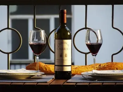 a bottle of wine and two glasses on a table at 