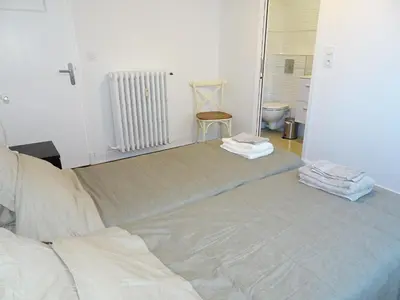 a bedroom with a large bed with towels on it at 