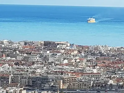 a city with a cruise ship in the water at Maison / Appart Le PIOL in Nice
