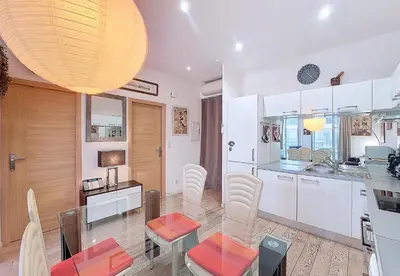 a kitchen and dining room with a table and chairs at Nestor&Jeeves - TROIS PROMENADE - Central - Very close sea in Nice