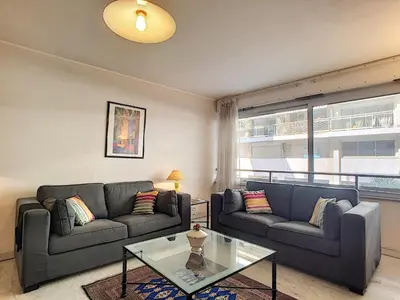 a living room with two couches and a glass table at Nestor&Jeeves - MARIN DEBUSSY - Central - By shopping area in Nice