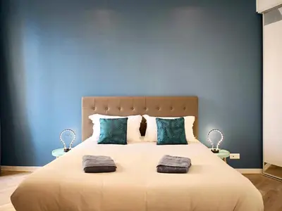a bedroom with a large bed with two pillows at Appartement Urban 3 in Nice