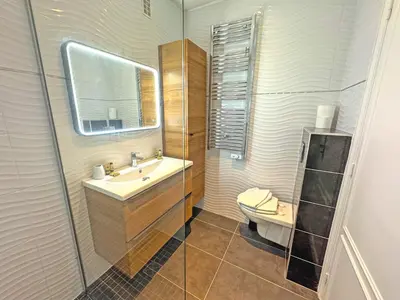 a bathroom with a sink and a toilet at CARIATIDES STUDIO - PROMENADE HOLIDAY in Nice