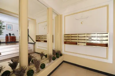 a hallway with a large window with plants in it at Suite Halevy 5 stars Holiday House in Nice