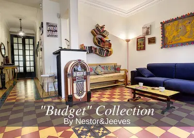 a living room with a couch and a table at Nestor&Jeeves - SIXTIES - Central - Very close sea - Retro in Nice