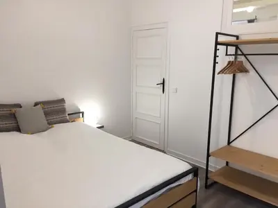 a small bedroom with a bed and a ladder at Port de Nice in Nice