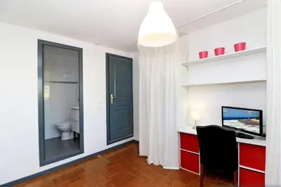 a room with a desk with a computer and a window at SOPHIES HOMES APARTEMENT BEACH and PROMENADE DES ANGLAIS in Nice