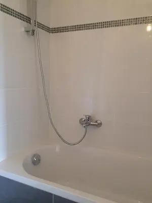 a bathroom with a bath tub with a shower at SOPHIES HOMES APARTEMENT BEACH and PROMENADE DES ANGLAIS in Nice