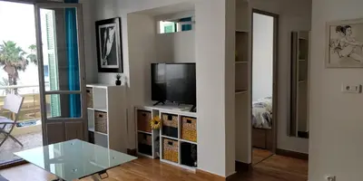 a living room with a tv and a glass table at Nice Seaview Free Parking 4.Pers in Nice