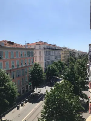 a view of a city street with trees and buildings at Studios Floreal in Nice