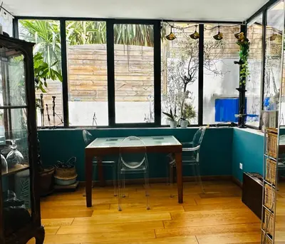 a dining room with a table and two chairs at Villa Iris in Nice