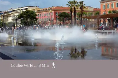 a fountain in the middle of a city at Nice Central Art Deco Flat 45 m² in Nice