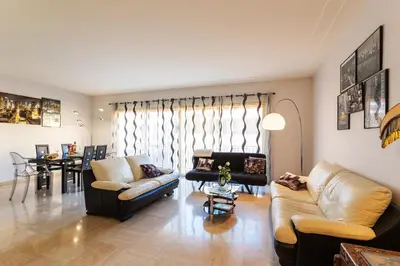a living room with two couches and a table at Le Joffre Grimaldi Nice AP2089 in Nice