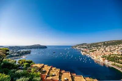 a view of a bay with boats in the water at RESIDENCE DU CAP AP2027 - Villefranche-sur-Mer, by Riviera Holiday Homes in Villefranche-sur-Mer
