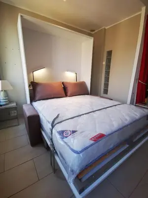 a bedroom with a large bed in a room at Charmant studio tout proche du port in Nice