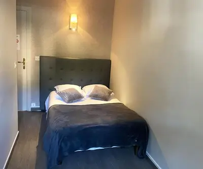 a bedroom with a bed with two pillows on it at Hôtel La Villa d'Eze in Èze
