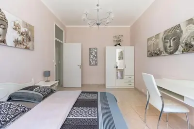 a bedroom with a bed and a desk in it at NOTRE DAME - Huge sunny modern 2BR flat - Terrace in Nice