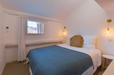 a bedroom with a bed and a window at Ze Perfect Place - Vieux Nice - Exceptionnel Appartement - Calme et Terrasse avec vues in Nice