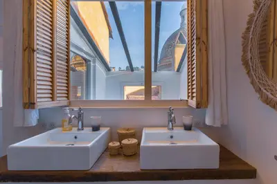 two sinks in a bathroom with two windows at Ze Perfect Place - Vieux Nice - Exceptionnel Appartement - Calme et Terrasse avec vues in Nice