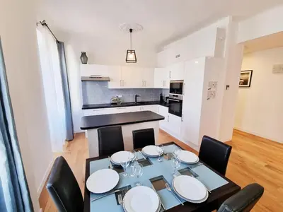 a kitchen and dining room with a table and chairs at 