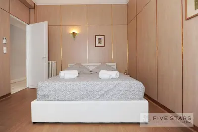 a bedroom with a bed with two pillows on it at Suite Gioia five stars holiday house in Nice