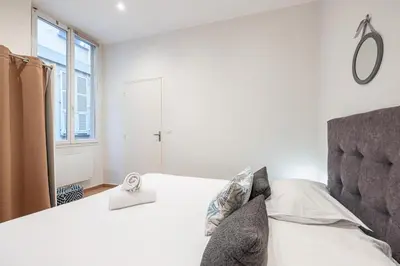 a bedroom with a bed and a window at Charming 1 Bdr Old town in Nice