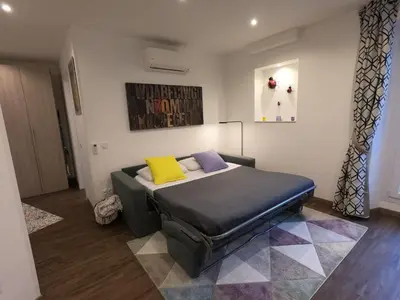 a bedroom with a bed with two pillows on it at Coccinelle in Nice