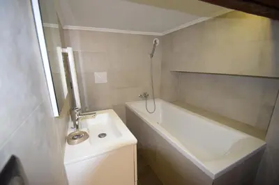 a bathroom with a sink and a bath tub and a sink at Jade Duplex - No Better Location In Nice in Nice