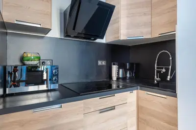 a kitchen with a sink and a microwave at JEAN MÉDECIN - Modern Flat - Heart of center in Nice
