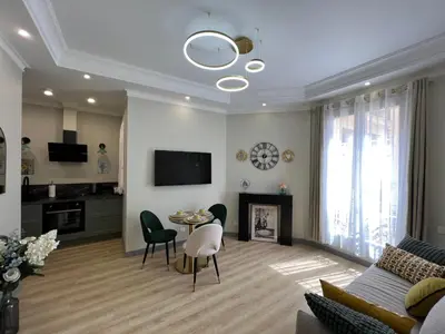 a living room with a couch and a table at Amour-35 in Nice