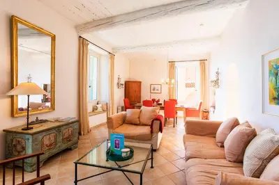 a living room with a couch and a table at ON VILLEFRANCHE BAY - AP3040 by Riviera Holiday Homes in Villefranche-sur-Mer
