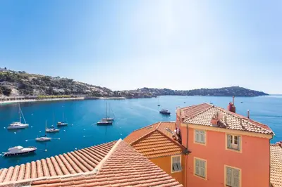 a view of a harbor with boats in the water at BELVEDERE AP1059 Villefranche-sur-Mer by Riviera Holiday Homes in Villefranche-sur-Mer