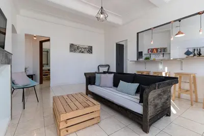 a living room with a couch and a table at Bright Apartment Old Town in Nice
