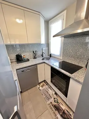 a kitchen with a sink and a stove at DIEGO 4 pièces duplex in Nice