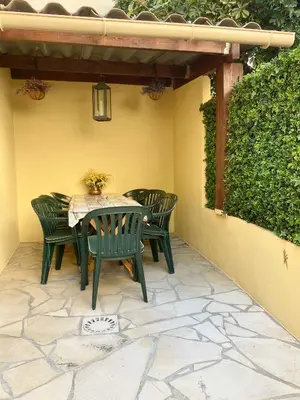 a table and chairs sitting on a patio at DIEGO 4 pièces duplex in Nice