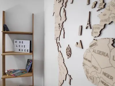 a map of the united states on a wall next to a book shelf at Best Apart - Nice Port - Balcony in Nice