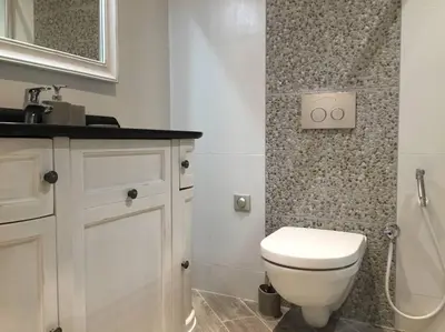 a bathroom with a white toilet and a sink at Beautiful apartment Rue De La Croix Vieux Nice in Nice
