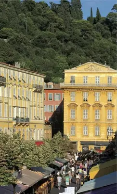 a group of buildings with people standing in front of them at Appartement Les Plages in Nice